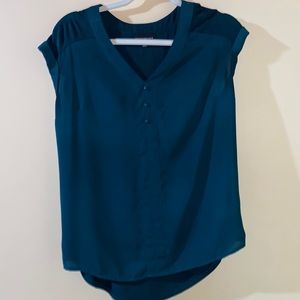 Woman’s emerald green blouse